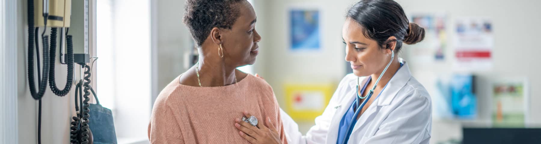 Doctor listening to a patient’s heart with a stethoscope