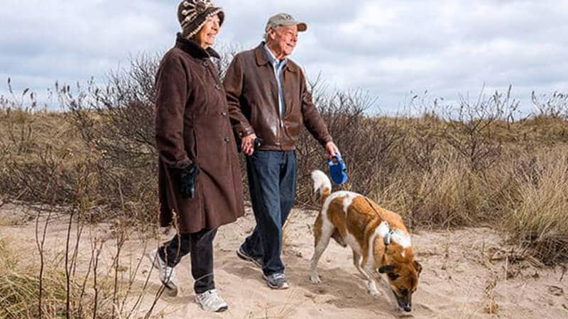 Marie and Robert Baffa walking their dog